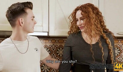 Curly-haired housewife Tanya Foxx screws a teen neighbor in the kitchen