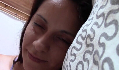 Amateur mom plays with her huge juggs while talking on the phone