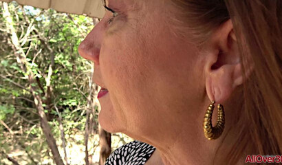 Shameless granny Lynn walks in a short skirt without panties