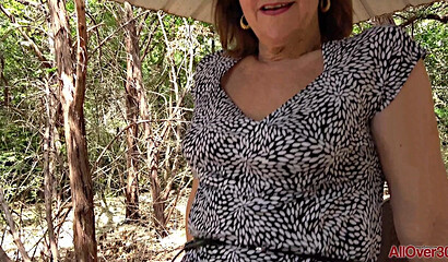 Shameless granny Lynn walks in a short skirt without panties