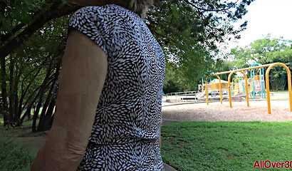 Shameless granny Lynn walks in a short skirt without panties